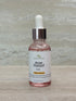 Face oil for acne relief in glass dropper bottle, reduces breakouts and soothes skin.