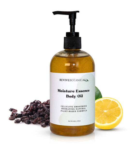 250ml bottle of Moisture Essence Body Oil with natural ingredients, lemon slice, and seeds