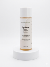 bottle of clarifying toner with mandelic and salicylic acid for exfoliating and treating hyperpigmentation