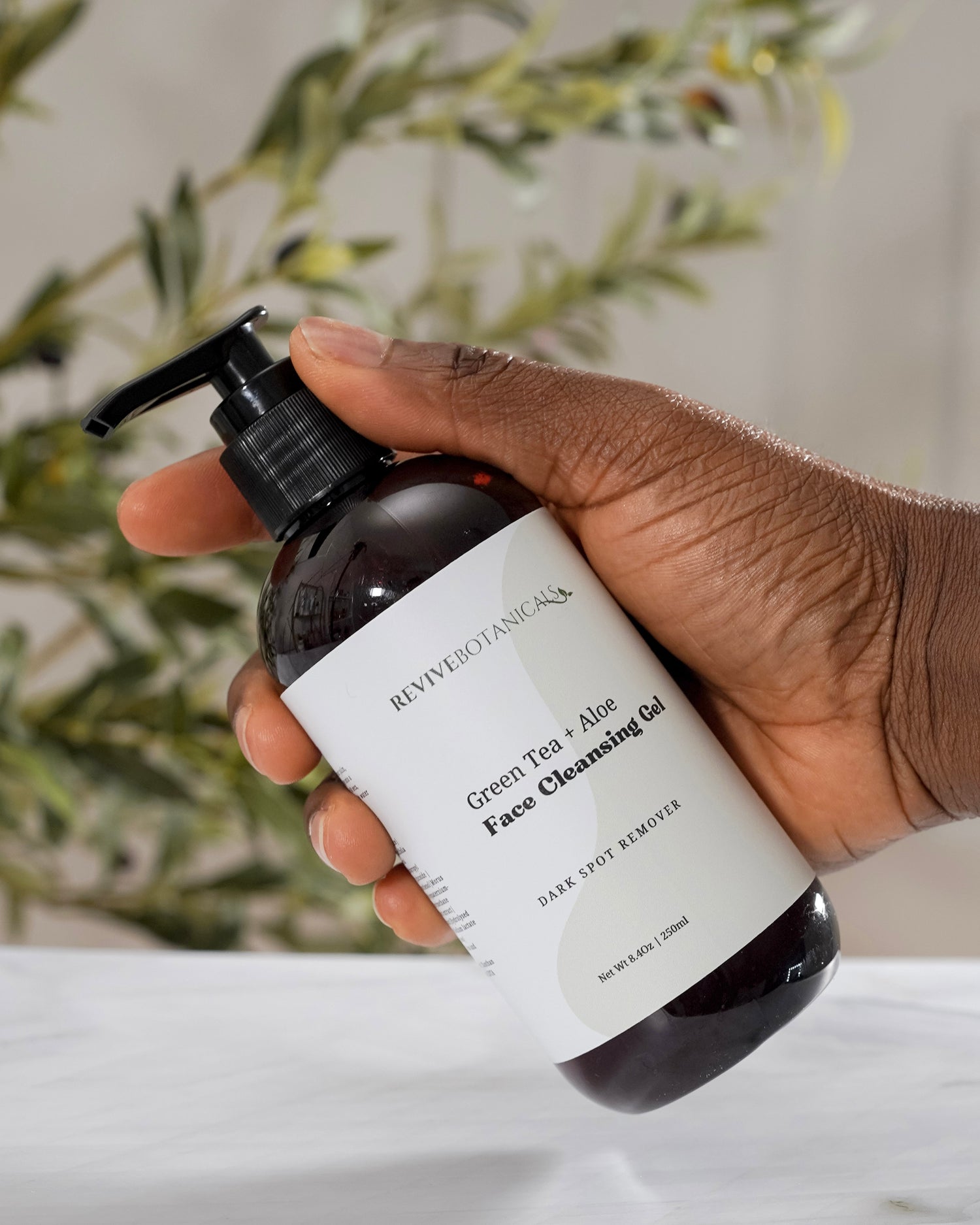 Green Tea + Aloe Face Cleanser in a pump bottle for acne and sensitive skin.