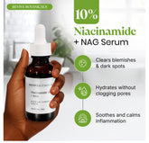 Hand holding Revive Botanicals 10% Niacinamide + NAG Serum bottle for brightening and blemish control with vitamin B3 and hydration benefits